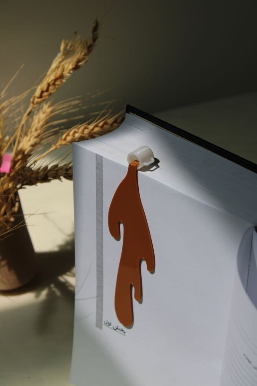 نشان کتاب دسته‌دار قهوه ریخته