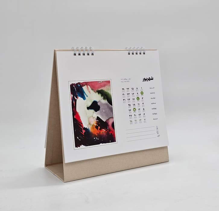 تقویم رومیزی 1404 (21*21)،(کارت پستال های سپهر زهرایی)،(سیمی)