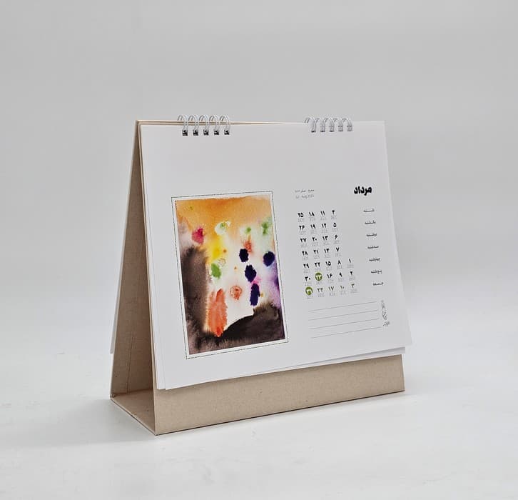 تقویم رومیزی 1404 (21*21)،(کارت پستال های سپهر زهرایی)،(سیمی)